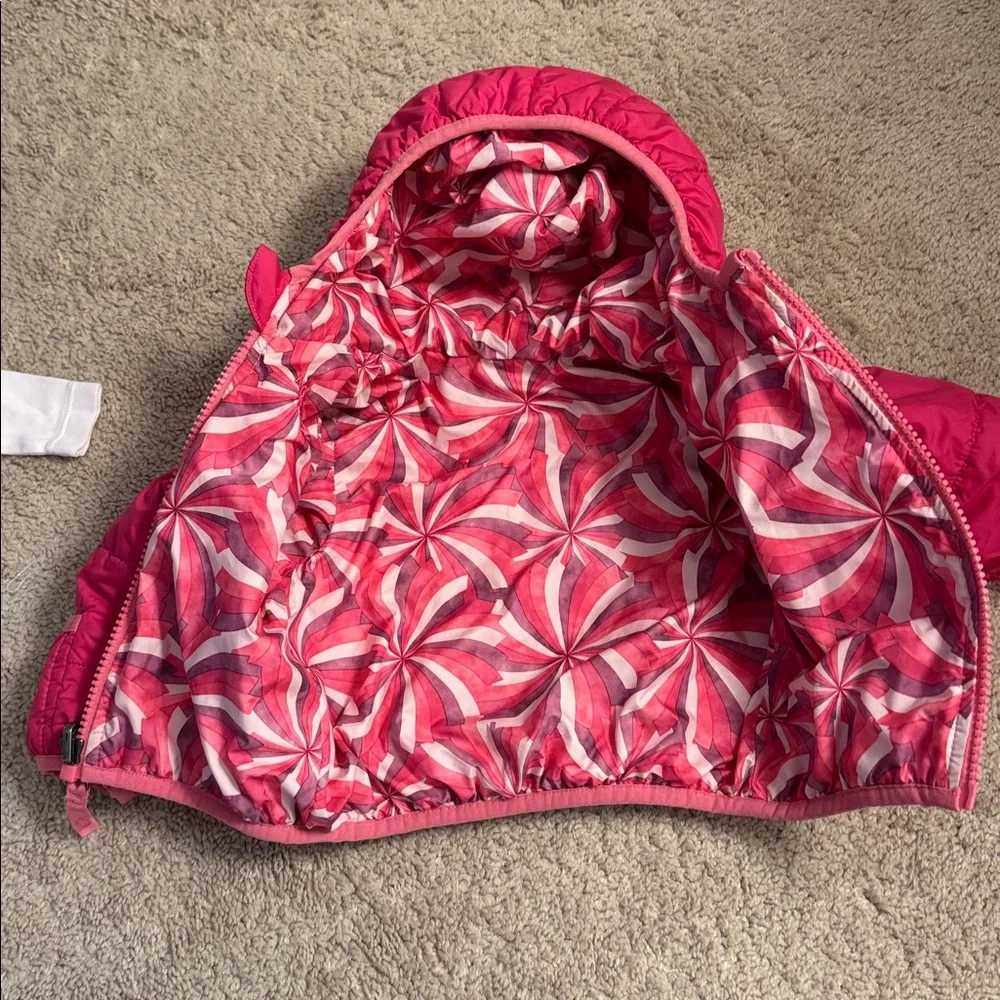 The North Face Pink Quilted Girls' Puffer Jacket with Patterned Lining